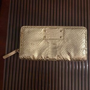 Very Pretty Kate Spade Zip Around Gold Lema Leather Wallet.